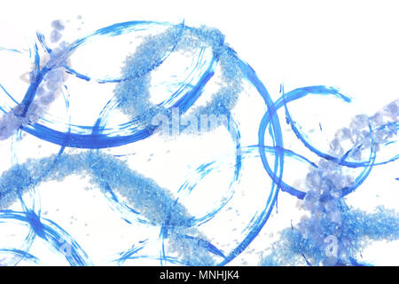 Isolated precious stones, that look like ice, with shadows from two lights, scattered over blue circles from acrylic brush strokes Stock Photo