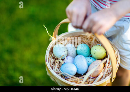 Close up of colorful Easter eggs in a basket Stock Photo