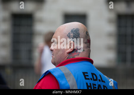 An EDL head steward overseas the march in central London Stock Photo