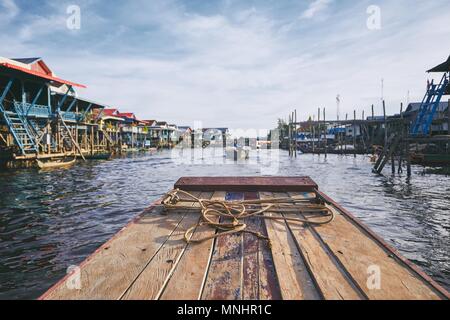 Boat in the middle of the floating village on Tonle Sap Lake. Siem Reap Province, Cambodia. Stock Photo