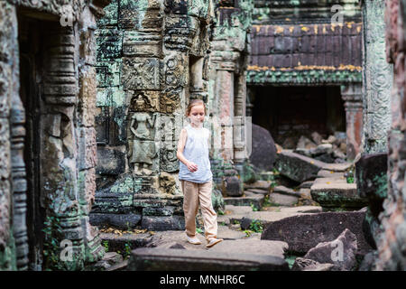 Little girl in ancient Angkor Wat temple in Siem Reap,  Cambodia Stock Photo