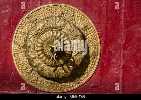 Beautiful golden door handle in Spitok monastery, Ladakh, India. Architecture detail close-up Stock Photo