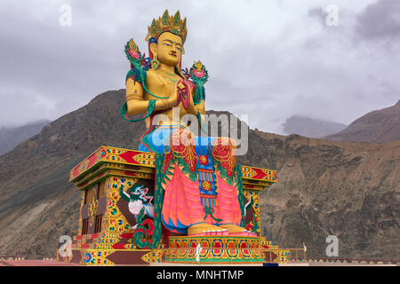 Maitreya Buddha statue with Himalaya mountains in the back at Diskit Monastery, Nubra Valley, Ladakh, India. Stock Photo