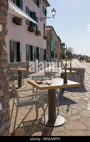 Cozy outdoor cafe at Burano island in Venice, Italy Stock Photo