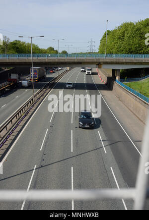 Traffic on M60 motorway at junction 17 passing under A56 road in whitefield greater manchester uk Stock Photo