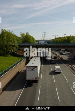 M60 motorway Whitefield interchange at junction 17 traffic driving under A56 road bridge in greater manchester uk Stock Photo