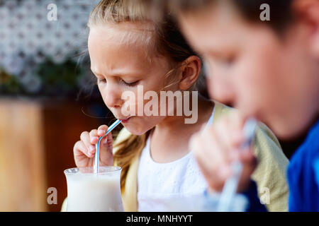 Brother and sister drinking milk Stock Photo - Alamy