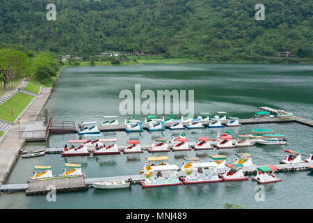 Swan paddle boats float at parking dock, Liyu Lake or Carp Lake, Shoufeng Township, Hualien County, Taiwan Stock Photo