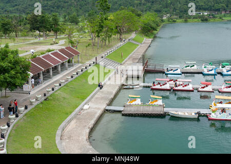 Swan paddle boats float at parking dock, Liyu Lake or Carp Lake, Shoufeng Township, Hualien County, Taiwan Stock Photo