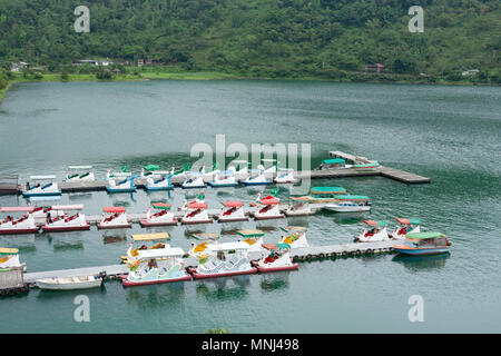 Swan paddle boats float at parking dock, Liyu Lake or Carp Lake, Shoufeng Township, Hualien County, Taiwan Stock Photo