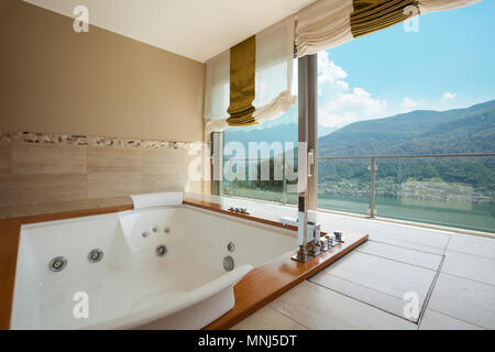 Interior of luxury apartment, comfortable bathroom with jacuzzi Stock Photo  - Alamy