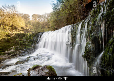 The Sgwd Isaf Clun-Gwyn (Lower Fall of the white Meadow) waterfall on the River Mellte near Ystradfellte in Powys, Wales Stock Photo