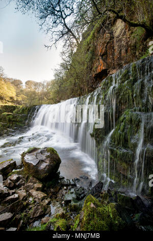 The Sgwd Isaf Clun-Gwyn (Lower Fall of the white Meadow) waterfall on the River Mellte near Ystradfellte in Powys, Wales Stock Photo