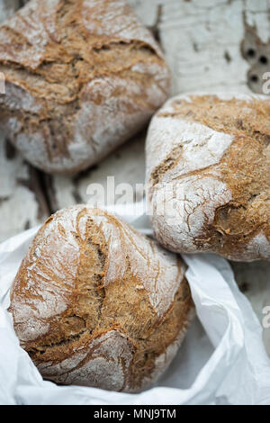 Wholegrain rolls in paper bag Stock Photo