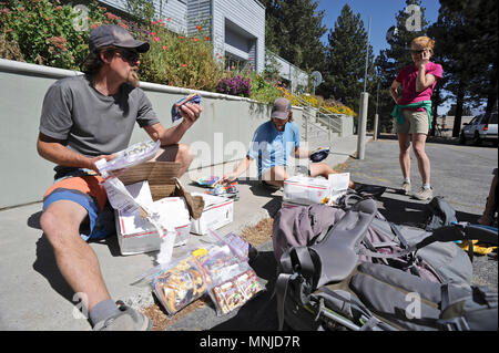 Backpackers resupply before long trail in town of Mammoth Lakes on trek of Sierra High Route in California, USA Stock Photo