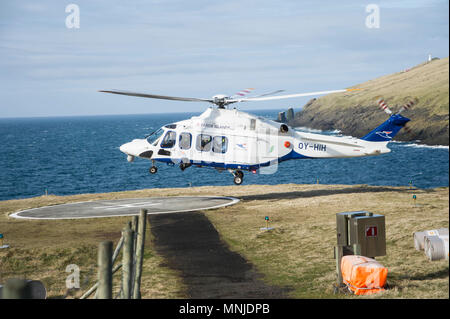 Helicopter landing in Faroe Islands Stock Photo