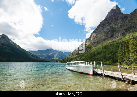 Tourboat on shore of Lake Josephine, Glacier National Park, Montana, USA Stock Photo