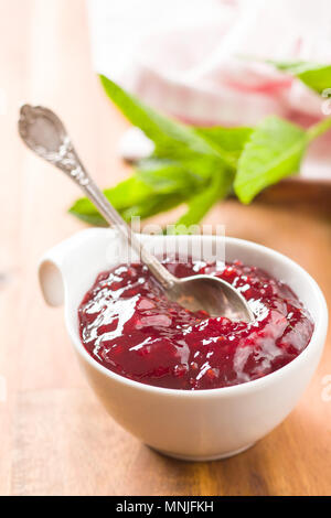 Raspberry jam jelly in bowl. Stock Photo
