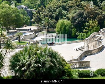 People exploring and relaxing in Les Jardins de la Fontaine, Fountain Gardens, Nîmes, France Stock Photo
