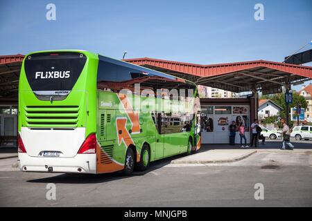 VUKOVAR, CROATIA - APRIL 20, 2018: Flixbus bus ready for departure in Vukovar Bus station. Flixbus is a German brand which offers low cost intercity b Stock Photo