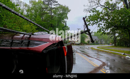 A close-up of the front car accident, collided with an electric pole until it was severely damaged. after a severe storm Stock Photo