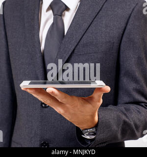 Businessman holds digital tablet. Close-up shot. Stock Photo