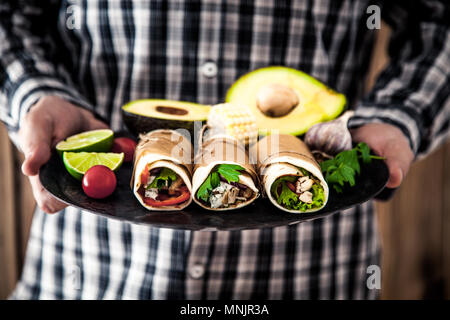 Man with snacks and dips. Tortilla mexican food Stock Photo