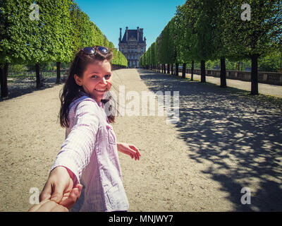 Follow me girl in Paris at Avenue in the Tuileries Garden Stock Photo