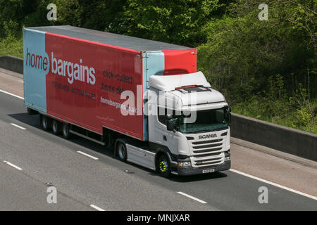 B&M Bargains store, b&m home store, B & M Store, B & M Stores, B&M big bargains, big savings, B&M signage, B&M Bargains articulated lorry; Scania R450 Home Bargains heavy goods & commercial traffic, haulage, lorry, transportation, truck, cargo, vehicle, delivery, transport, industry, freight on the M6 southbound, UK Stock Photo