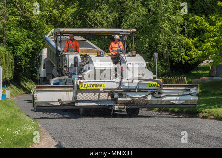 Road resurfacing team as work in an Essex village Stock Photo