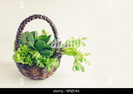 Assorted green vegetables food background as a healthy eating concept of fresh garden produce organically grown as a symbol of health. Basket with raw Stock Photo
