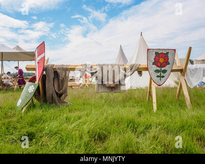 RITTER WEG, MOROZOVO, APRIL 2017: Outdoor scene of medieval way of life. Vintage protective knigts clothes hanging on the hedge in medieval camp in Morozovo, Russia Stock Photo