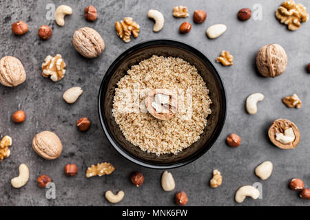 Delicious walnuts on grey rustic background Stock Photo