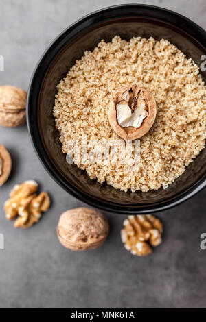 Delicious walnuts on grey rustic background Stock Photo