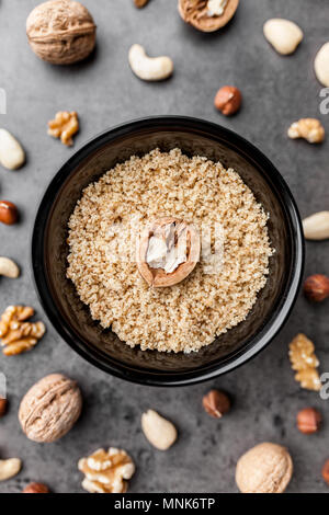 Delicious walnuts on grey rustic background Stock Photo