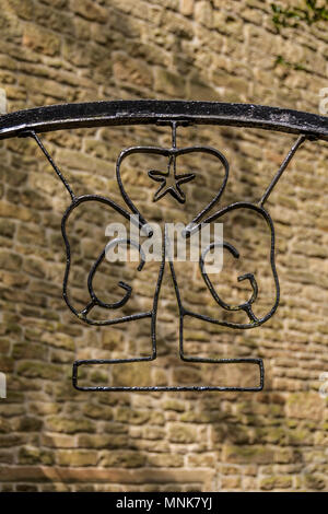 Wrought iron work. Sign over a gate from Victorian times Stock Photo