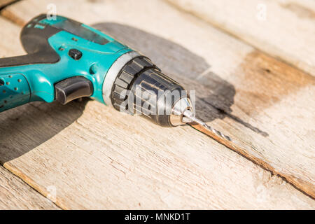 Man working with an electric screwdriver Stock Photo