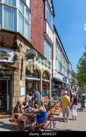 Cafe and shops on Spring Gardens in the town centre, Buxton, Derbyshire, England, UK Stock Photo