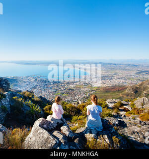 Family enjoying breathtaking views of Cape Town from top of Table mountain Stock Photo