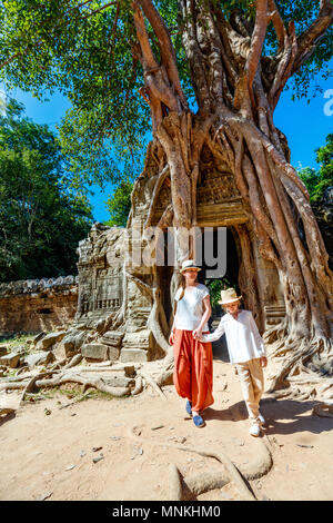 Family visiting ancient Ta Som temple in Angkor Archaeological area in Cambodia Stock Photo