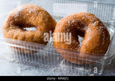 Sugared Donuts in Plastic Box. FastFood. Stock Photo