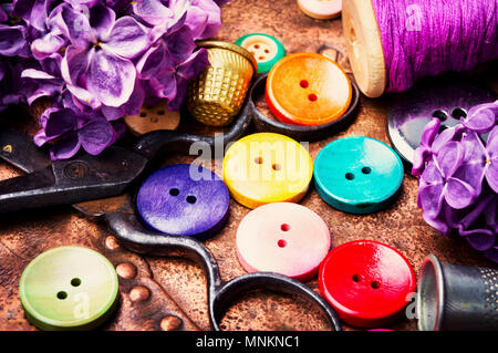 Set buttons from clothes, threads and scissors.Sewing accessories. Stock Photo