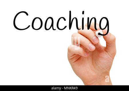 Hand writing Coaching with black marker on transparent wipe board. Stock Photo