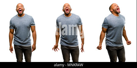 African american man with beard stressful, terrified in panic, shouting exasperated and frustrated. Unpleasant gesture. Annoying work drives me crazy Stock Photo