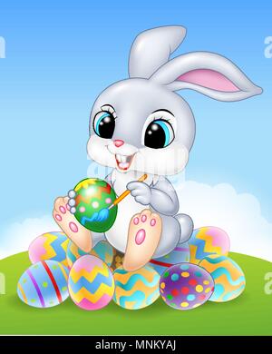 Cartoon Easter Bunny painting an egg on the easter eggs Stock Vector