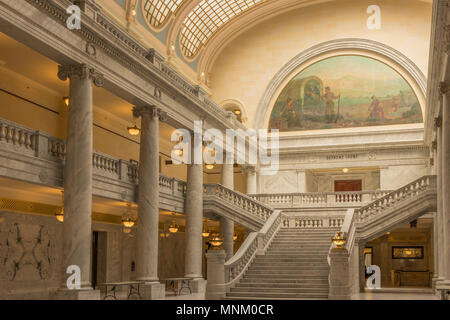 Salt Lake City, Utah, USA - May 3, 2018: Interior view of the State Capital Building and Supreme Court with mural, marble columns and staircase. Stock Photo