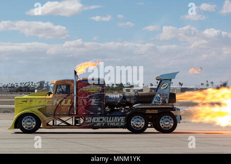 Chris Darnell, pilot of the Shockwave Jet Truck, blazes down the Marine Corps Air Station Yuma, Ariz., flight line during the 2018 Yuma Airshow Saturday, March 17, 2018. The Flash Fire Jet Trucks are the world's fastest jet powered trucks achieving a record of 375 miles per hour. The airshow is MCAS Yuma's only military airshow of the year and provides the community an opportunity to see thrilling aerial and ground performers for free while interacting with Marines and sailors. Stock Photo