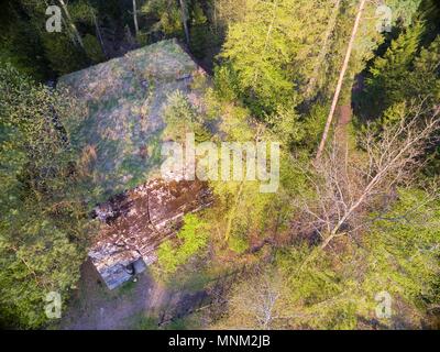 Aerial view of destroyed reinforced concrete bunker from the Second World War belonged to Himmler Headquarters Hochwald hidden in a forest in Pozezdrz Stock Photo