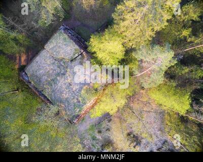Aerial view of destroyed reinforced concrete bunker from the Second World War belonged to Himmler Headquarters Hochwald hidden in a forest in Pozezdrz Stock Photo