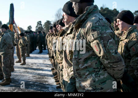 Soldiers from 2nd Battalion, 70th Armor Regiment, 2nd Armored Brigade Combat Team, 1st Infantry Division stand in formation while participating in a welcoming ceremony hosted by the Polish army in Świętoszów, Poland on March 19, 2018. Stock Photo